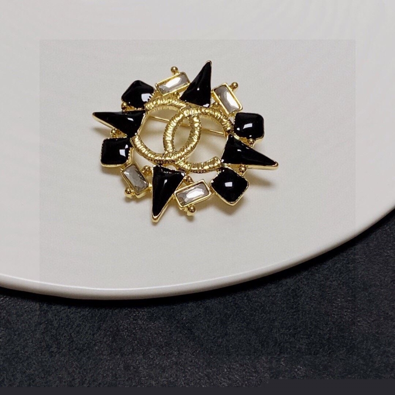 Ch*el brooches